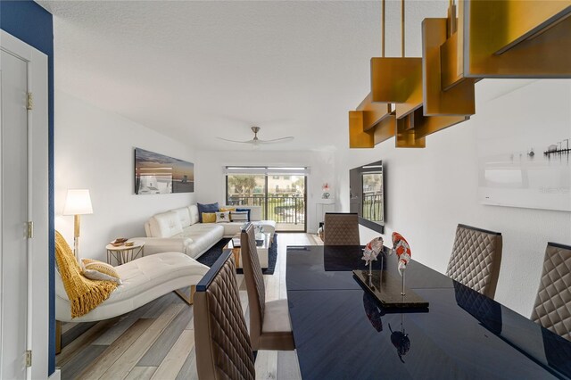 dining space featuring ceiling fan and light hardwood / wood-style floors