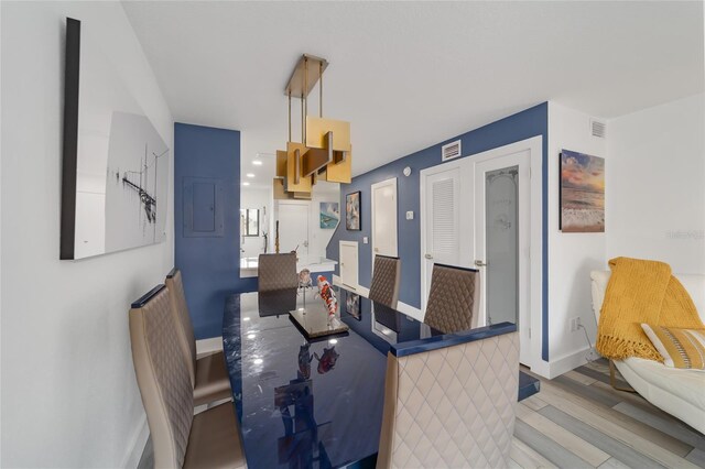 dining area with hardwood / wood-style floors