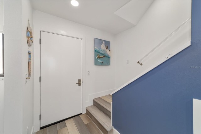 foyer with light hardwood / wood-style floors