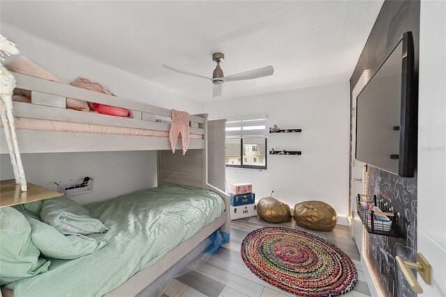 bedroom with hardwood / wood-style flooring and ceiling fan