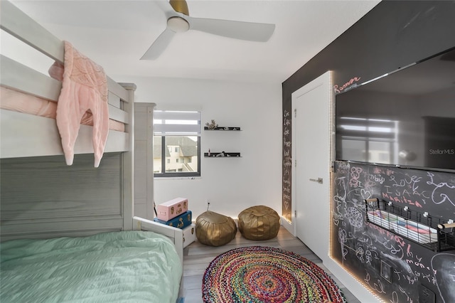 bedroom with hardwood / wood-style flooring and ceiling fan