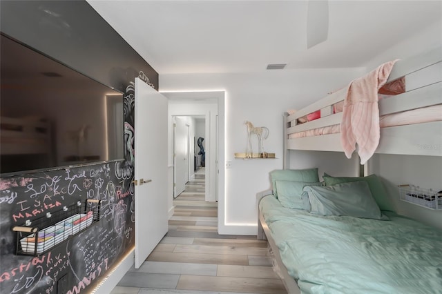 bedroom with light hardwood / wood-style floors