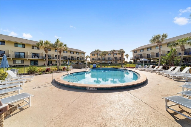 view of swimming pool featuring a patio area