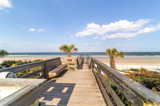 exterior space with a beach view and a water view