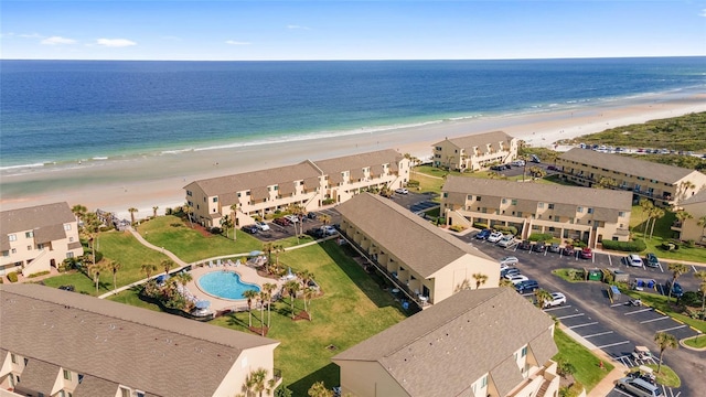 aerial view featuring a water view and a beach view