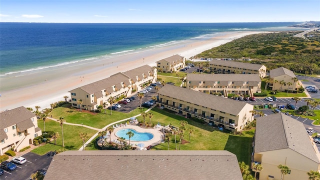 bird's eye view featuring a view of the beach and a water view