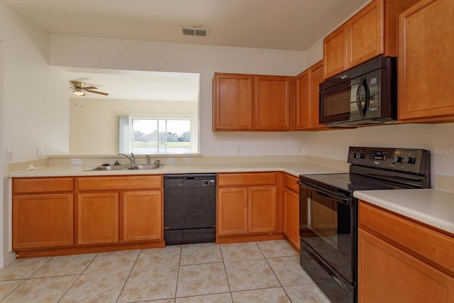 kitchen featuring light tile patterned floors, sink, ceiling fan, and black appliances