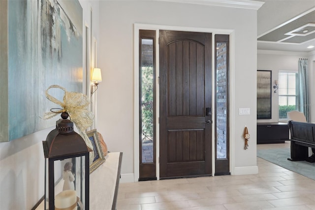 entryway featuring ornamental molding