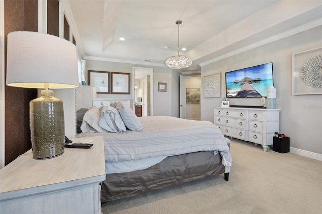 carpeted bedroom featuring a tray ceiling and ornamental molding