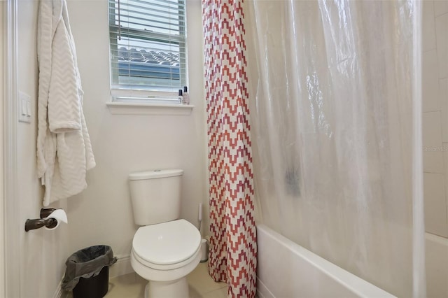 bathroom with toilet and shower / bath combo