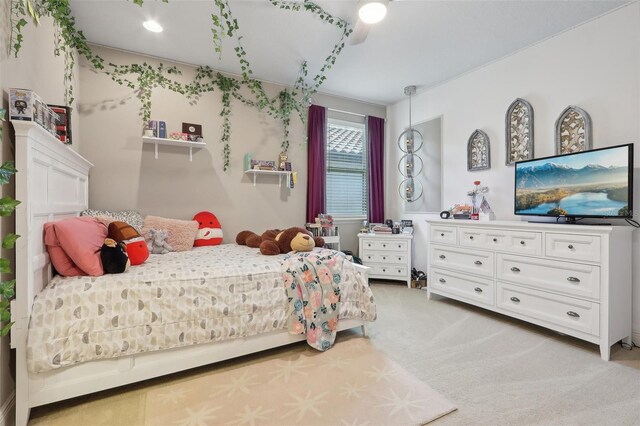 bedroom with light colored carpet