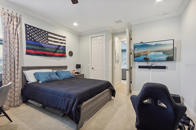 bedroom featuring crown molding, ceiling fan, and light colored carpet