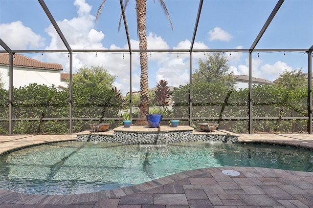 view of swimming pool with glass enclosure