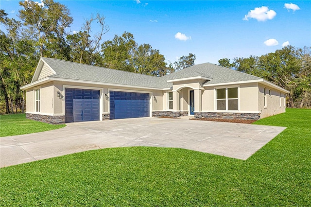 view of front facade with a garage and a front yard