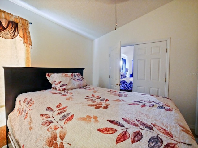 bedroom with vaulted ceiling