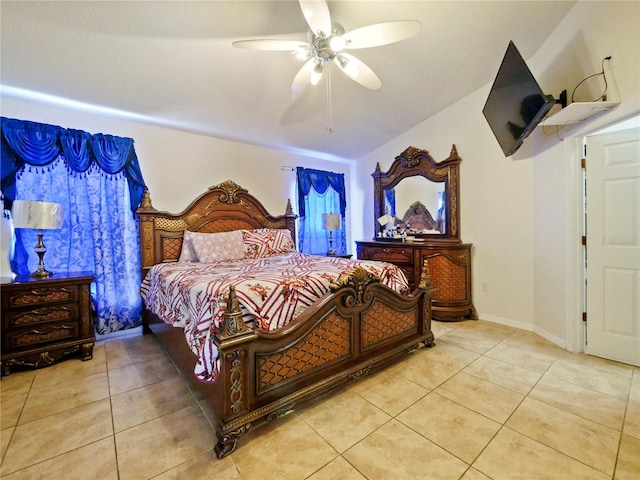 tiled bedroom with ceiling fan