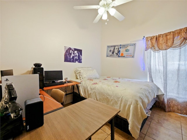 tiled bedroom with ceiling fan