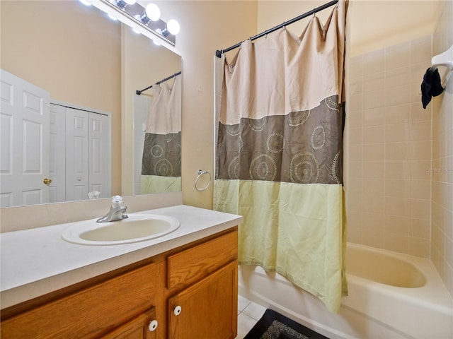 bathroom with shower / tub combo with curtain, vanity, and tile patterned flooring