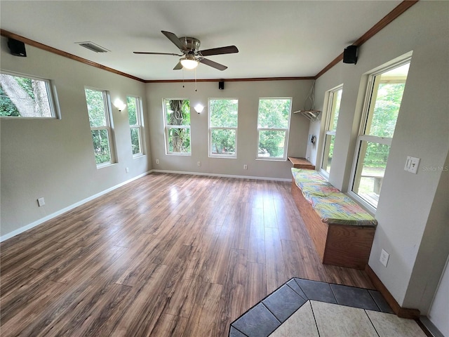 interior space with crown molding, ceiling fan, and wood-type flooring