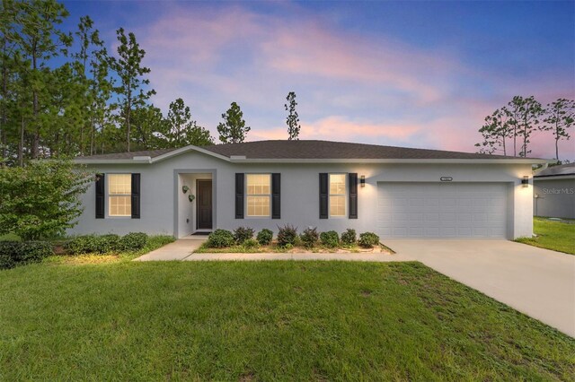 781 Marion Oaks Trl, Ocala, FL 34473 - single story home with concrete driveway, a garage, a front yard, and stucco siding
