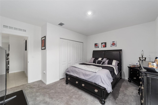 bedroom with a closet and carpet