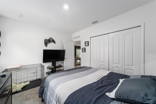 carpeted bedroom featuring a closet