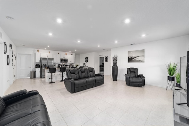 781 Marion Oaks Trl, Ocala, FL 34473 - living room with recessed lighting, visible vents, baseboards, and light tile patterned floors