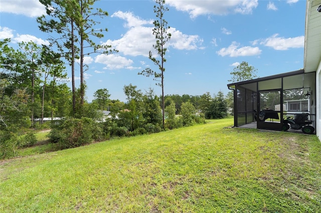 view of yard featuring a sunroom