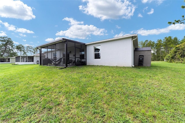 781 Marion Oaks Trl, Ocala, FL 34473 - rear view of house with a lawn, a sunroom, and stucco siding
