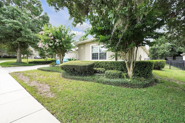 view of side of property featuring a yard