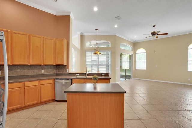 kitchen featuring tasteful backsplash, pendant lighting, light tile patterned flooring, a center island, and dishwasher