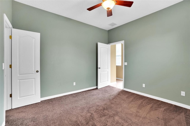 carpeted empty room with ceiling fan