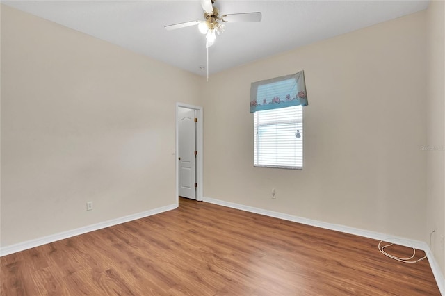 spare room featuring ceiling fan and hardwood / wood-style flooring