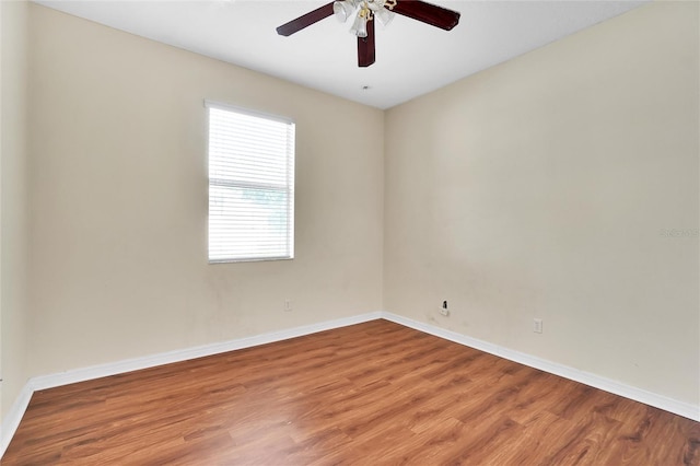 empty room featuring ceiling fan and hardwood / wood-style flooring