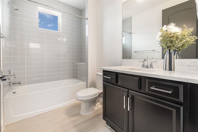 full bathroom featuring vanity, tiled shower / bath combo, and toilet