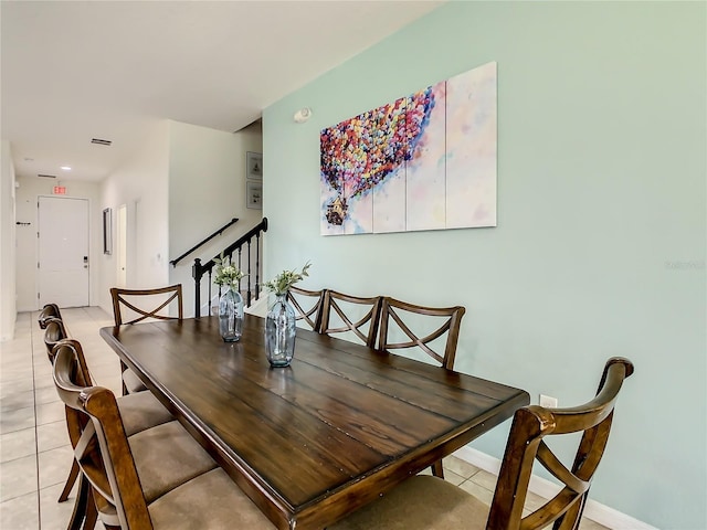 dining space featuring light tile patterned floors