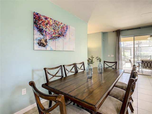 dining space featuring light tile patterned flooring