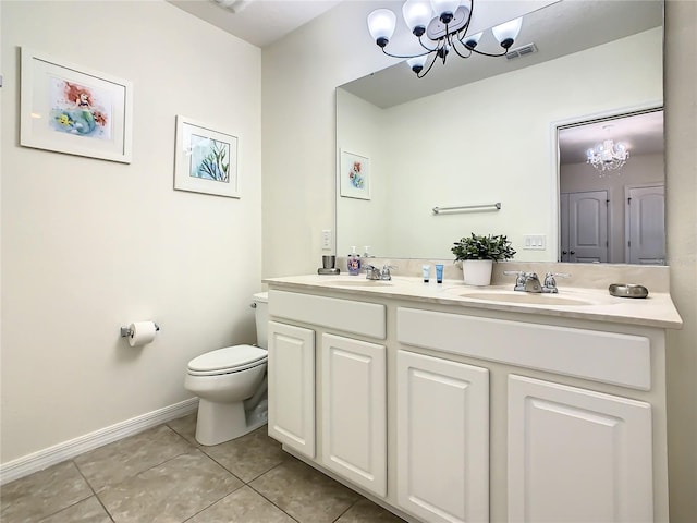 bathroom with vanity, tile patterned floors, a chandelier, and toilet