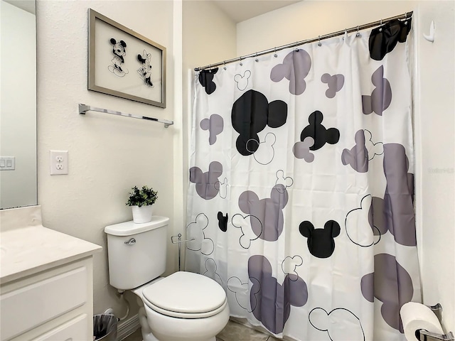 bathroom with vanity, toilet, and a shower with shower curtain