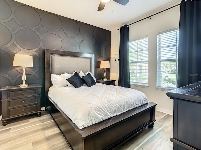 bedroom featuring ceiling fan and light hardwood / wood-style floors