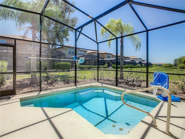 view of swimming pool featuring a lanai