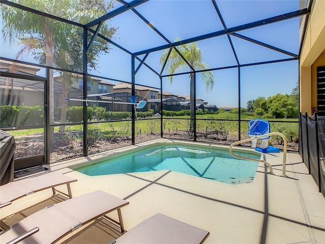 view of pool featuring a lanai and a patio