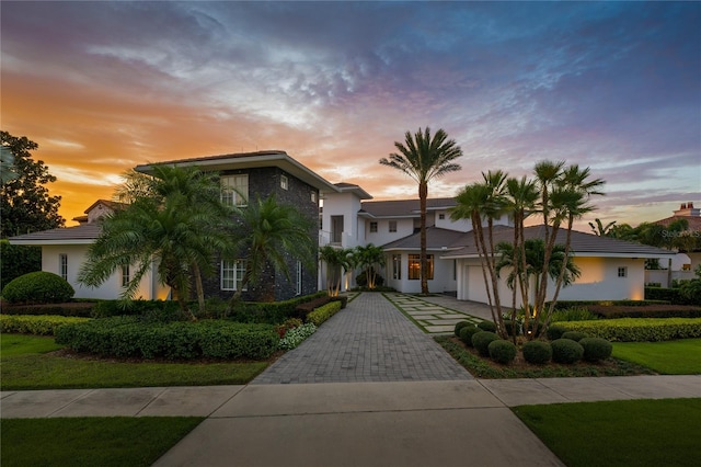 mediterranean / spanish-style house featuring a garage