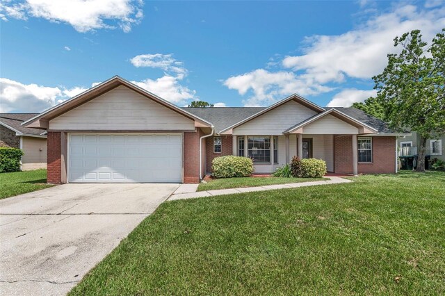 ranch-style home featuring a front lawn and a garage