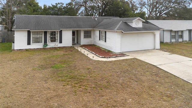 ranch-style house with a front yard and a garage