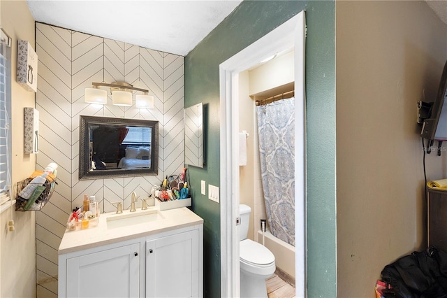 full bathroom featuring toilet, shower / tub combo, and vanity