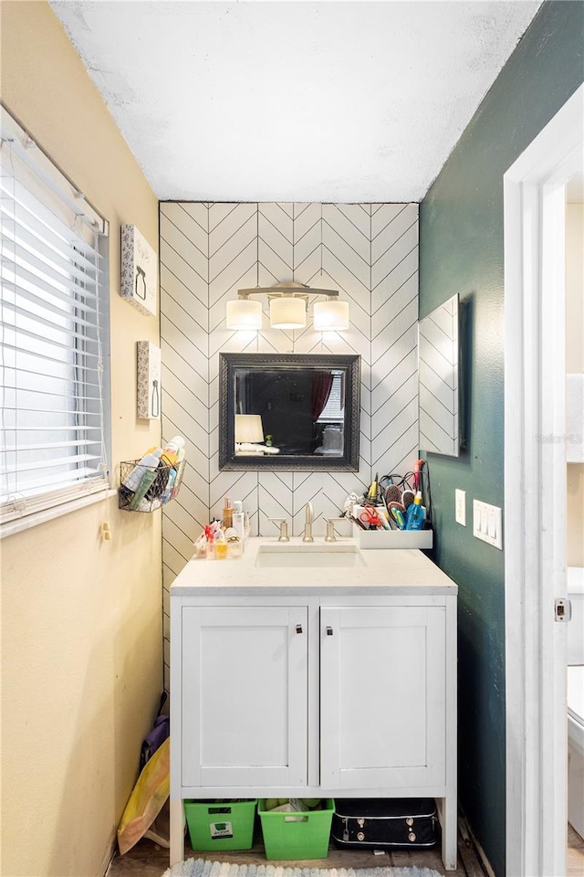 bathroom featuring toilet and vanity