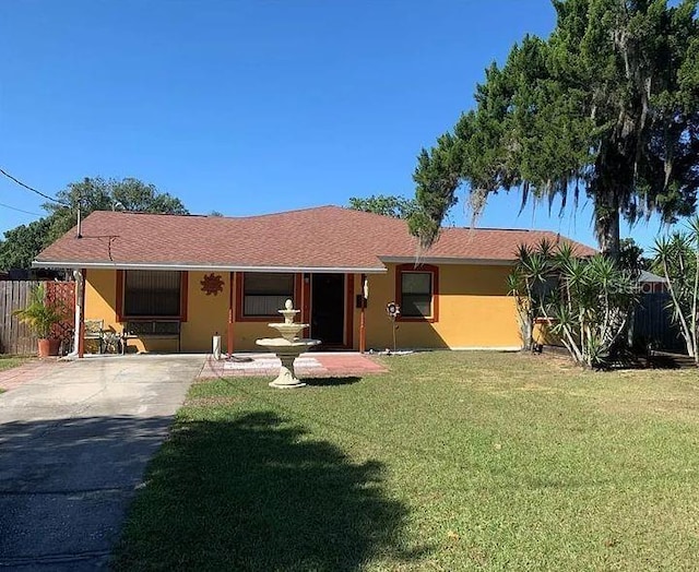 709 N Disston, Tavares, FL 32778 - ranch-style home featuring stucco siding and driveway