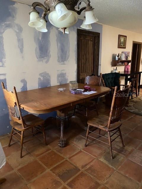 709 N Disston, Tavares, FL 32778 - dining area with a textured ceiling