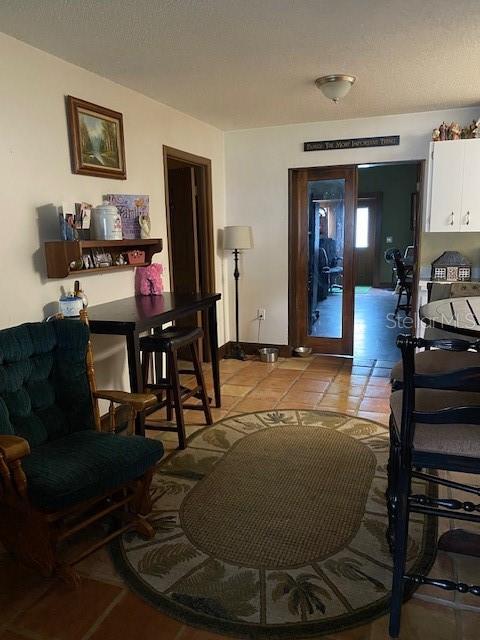 709 N Disston, Tavares, FL 32778 - living area with light tile patterned flooring